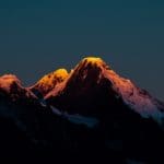 Sunlight Caps the Snowy Meili Mountain Range in a Majestic Photo Series